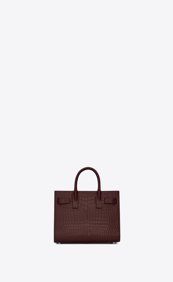 sac de jour nano in crocodile embossed leather rouge legion