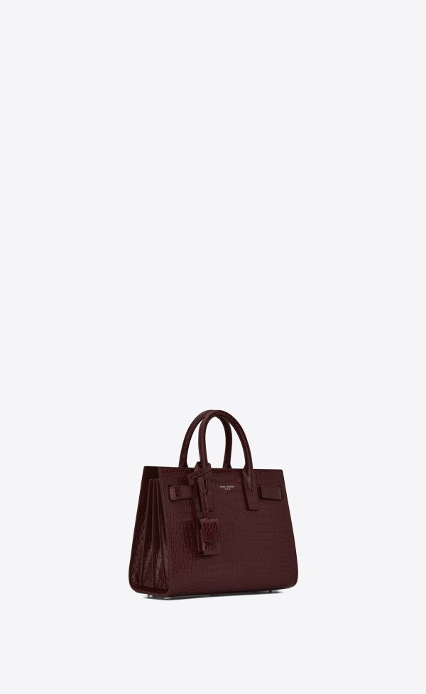 sac de jour nano in crocodile embossed leather rouge legion