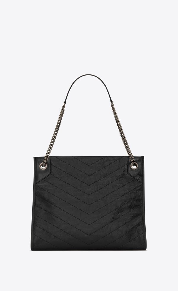 niki shopping in vintage leather black