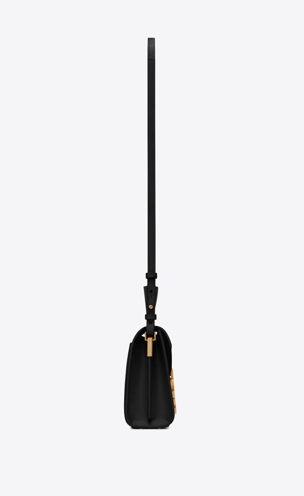 cassandra mini top handle bag in grain de poudre embossed leather black
