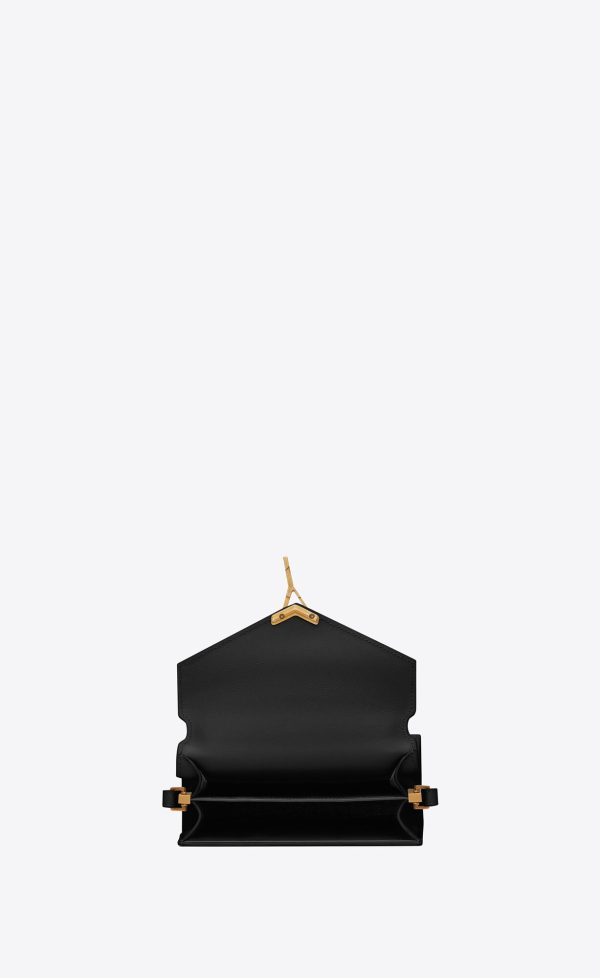 cassandra mini top handle bag in grain de poudre embossed leather black
