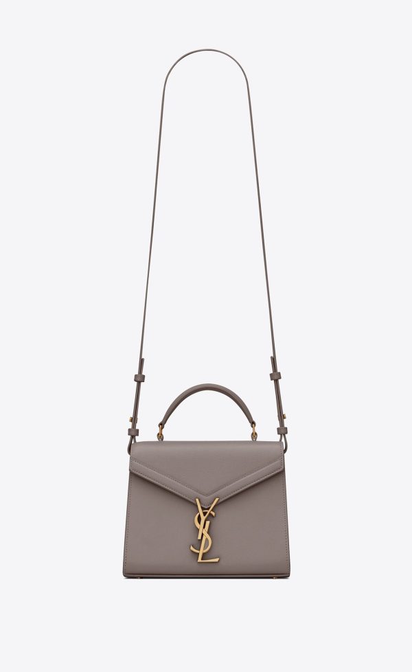 cassandra mini top handle bag in grain de poudre embossed leather fog