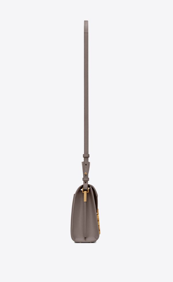 cassandra mini top handle bag in grain de poudre embossed leather fog