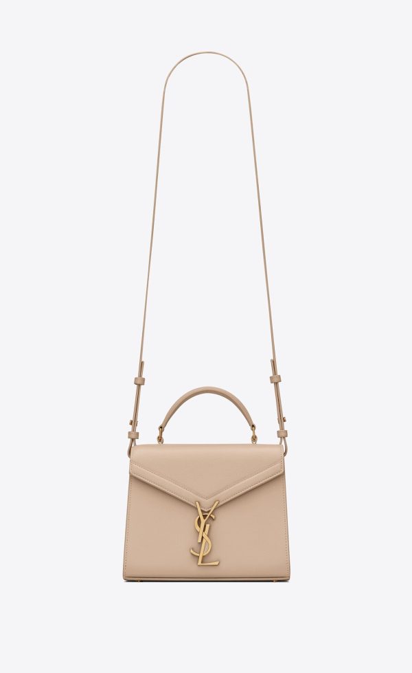cassandra mini top handle bag in grain de poudre embossed leather dark beige