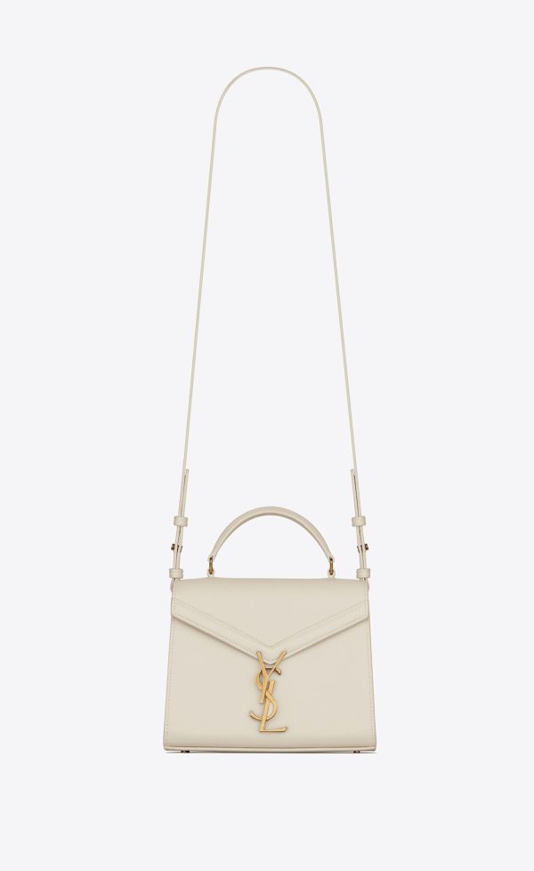 cassandra mini top handle bag in grain de poudre embossed leather blanc vintage