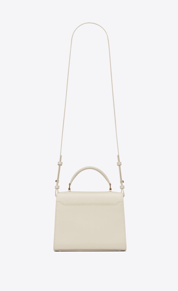 cassandra mini top handle bag in grain de poudre embossed leather blanc vintage