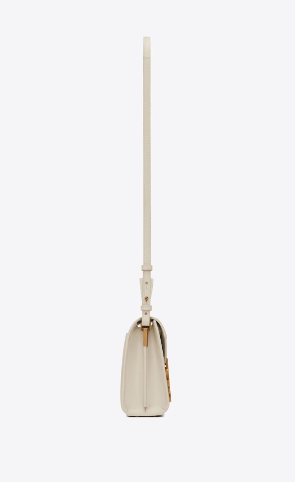 cassandra mini top handle bag in grain de poudre embossed leather blanc vintage