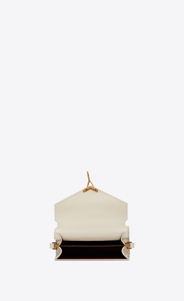 cassandra mini top handle bag in grain de poudre embossed leather blanc vintage
