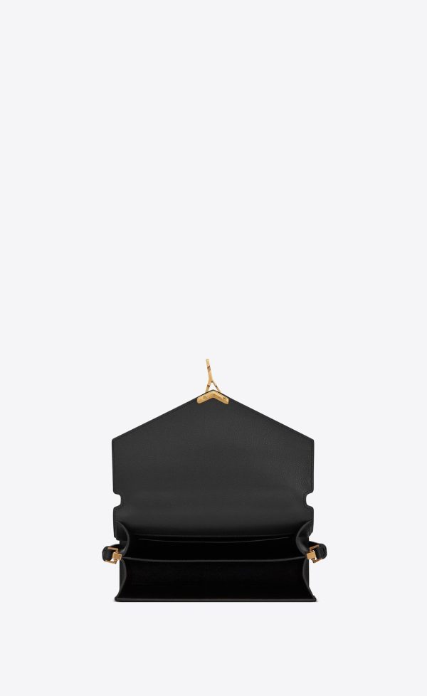 cassandra medium top handle bag in grain de poudre embossed leather black