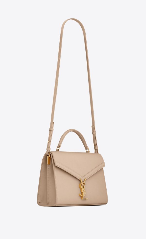 cassandra medium top handle bag in grain de poudre embossed leather dark beige