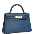 this kelly, in the sellier style, is in vert rousseau madame leather and shiny niloticus crocodile with gold hardware and has tonal stitching,front flap, two straps with center toggle closure, clochette with lock and two keys, single rolled top handle and removable shoulder strap. the interior is lined in vert rousseau chevre and has one zip pocket with hermes engraved pull and one open pocket on the opposite side. collection: u origin: france condition: pristine; new or never worn (plastic on hardware) accompanied by: hermes box, hermes dustbag, clochette, lock, two keys, shoulder strap, clochette dustbag, shoulder strap dustbag, felt, rainhat, ribbon, cites and carebook measurements: 9.8" width x 7.5" height x 3.5" depth; 3.5" handle drop this kelly, in the sellier style, is in vert rousseau madame leather and shiny niloticus crocodile with gold hardware and has tonal stitching,front flap, two straps with center toggle closure, clochette with lock and two keys, single rolled top handle and removable shoulder strap. the interior is lined in vert rousseau chevre and has one zip pocket with hermes engraved pull and one open pocket on the opposite side. collection: u origin: france condition: pristine; new or never worn (plastic on hardware) accompanied by: hermes box, hermes dustbag, clochette, lock, two keys, shoulder strap, clochette dustbag, shoulder strap dustbag, felt, rainhat, ribbon, cites and carebook measurements: 9.8" width x 7.5" height x 3.5" depth; 3.5" handle drop