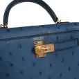 this kelly, in the sellier style, is in vert rousseau madame leather and shiny niloticus crocodile with gold hardware and has tonal stitching,front flap, two straps with center toggle closure, clochette with lock and two keys, single rolled top handle and removable shoulder strap. the interior is lined in vert rousseau chevre and has one zip pocket with hermes engraved pull and one open pocket on the opposite side. collection: u origin: france condition: pristine; new or never worn (plastic on hardware) accompanied by: hermes box, hermes dustbag, clochette, lock, two keys, shoulder strap, clochette dustbag, shoulder strap dustbag, felt, rainhat, ribbon, cites and carebook measurements: 9.8" width x 7.5" height x 3.5" depth; 3.5" handle drop this kelly, in the sellier style, is in vert rousseau madame leather and shiny niloticus crocodile with gold hardware and has tonal stitching,front flap, two straps with center toggle closure, clochette with lock and two keys, single rolled top handle and removable shoulder strap. the interior is lined in vert rousseau chevre and has one zip pocket with hermes engraved pull and one open pocket on the opposite side. collection: u origin: france condition: pristine; new or never worn (plastic on hardware) accompanied by: hermes box, hermes dustbag, clochette, lock, two keys, shoulder strap, clochette dustbag, shoulder strap dustbag, felt, rainhat, ribbon, cites and carebook measurements: 9.8" width x 7.5" height x 3.5" depth; 3.5" handle drop